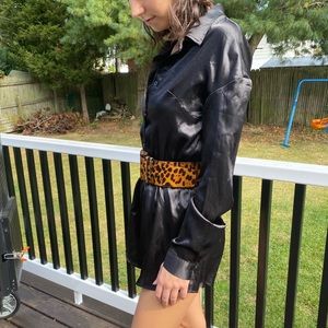 Black satin long sleeve button-up romper